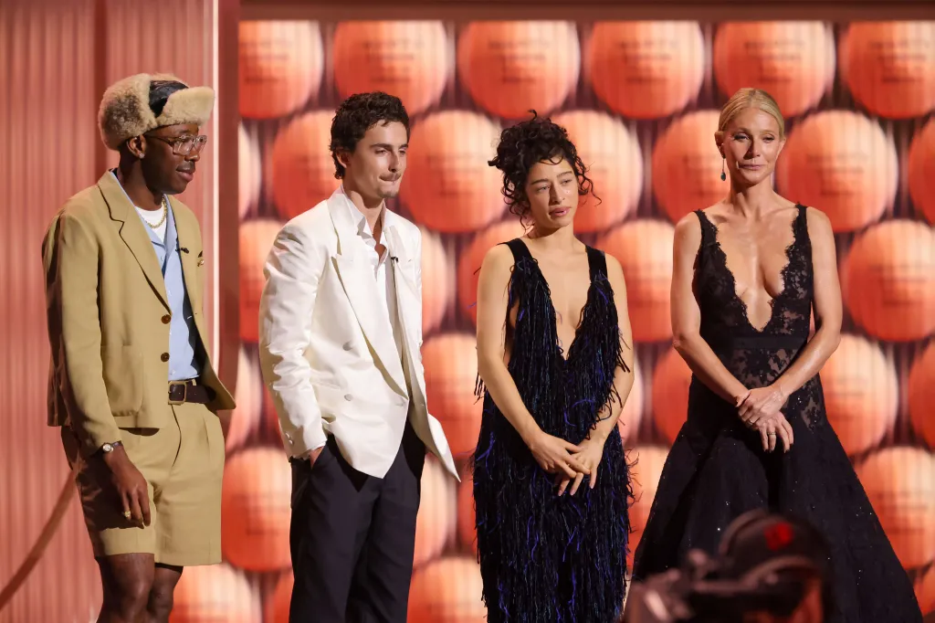 Tyler, The Creator, Timothée Chalamet, Odessa A'zion, and Gwyneth Paltrow standing on stage.