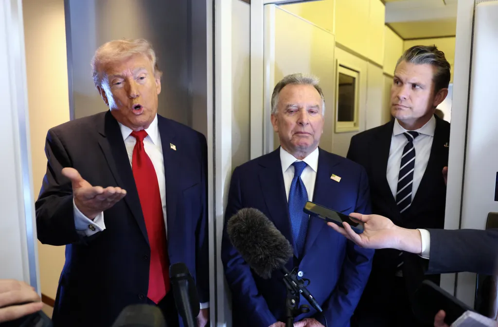 Donald Trump speaking to reporters aboard Air Force One with Steve Witkoff and Pete Hegseth.