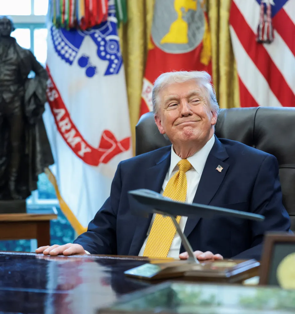 President Donald Trump reacting to an event in the Oval Office.