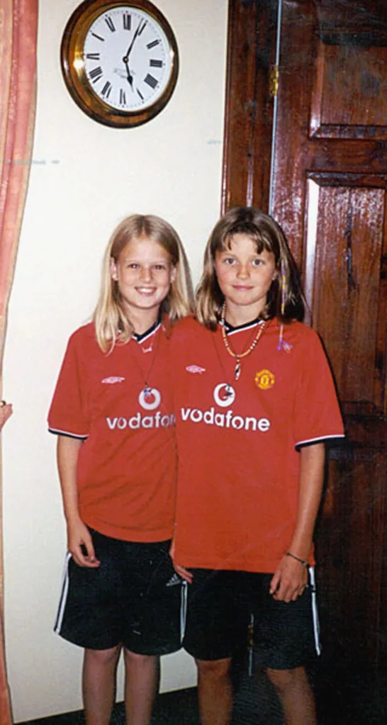 Holly Wells (left) and Jessica Chapman, wearing matching red shirts.