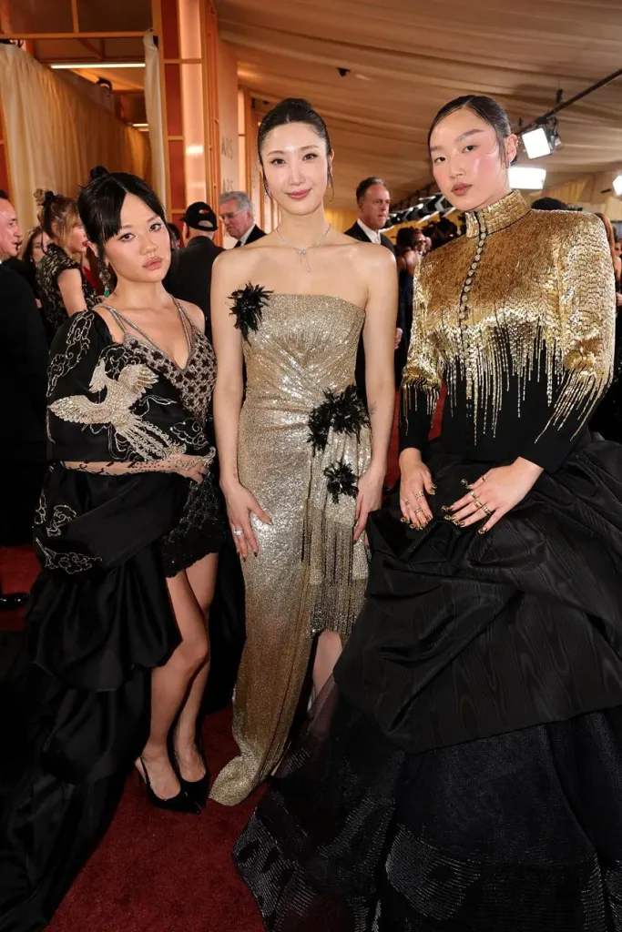 Rei Ami wearing Rahul Mishra couture, Ejae wearing custom Dior and Audrey Nuna wearing custom Thom Browne. Source: Getty