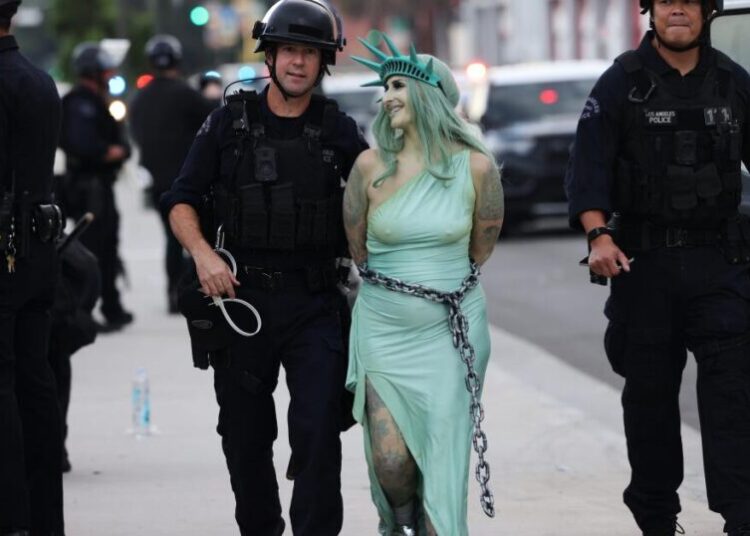 Dozens arrested after authorities fire tear gas at ‘No Kings’ protesters