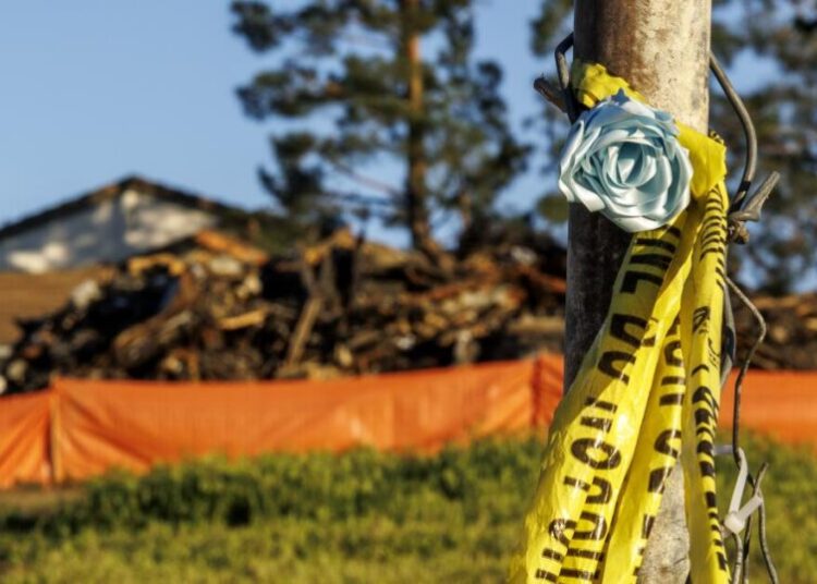 A house fire killed two of their three daughters. Prosecutors say they are to blame