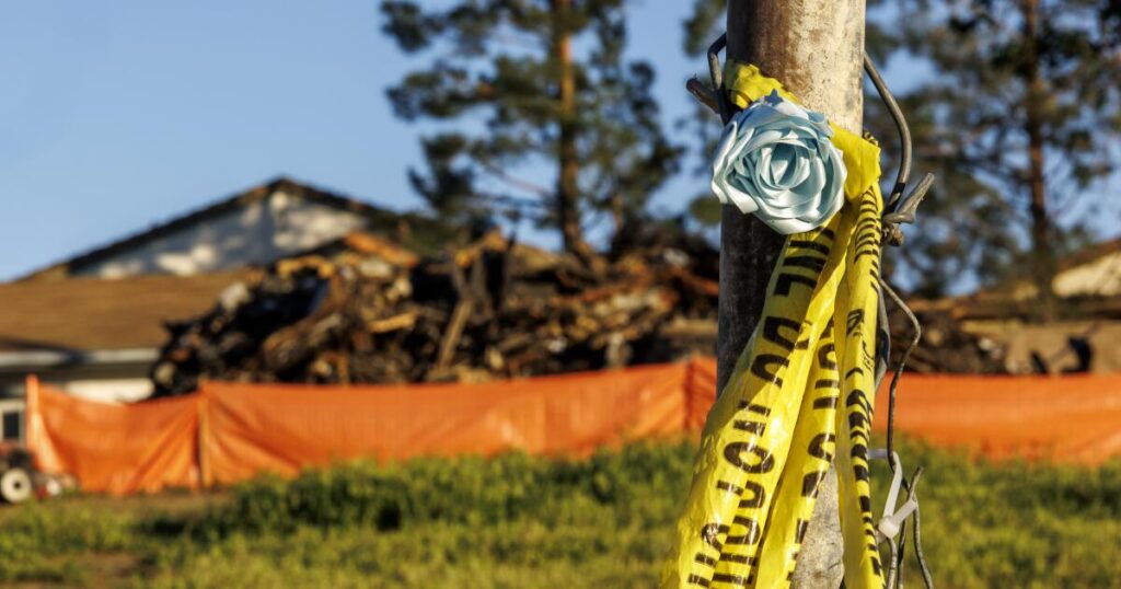 A house fire killed two of their three daughters. Prosecutors say they are to blame