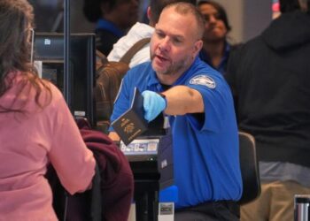 Some wait times at airport bottlenecks are easing with TSA paychecks promised