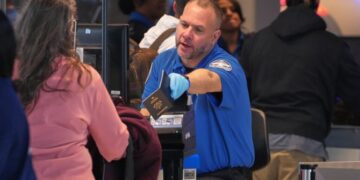 Some wait times at airport bottlenecks are easing with TSA paychecks promised