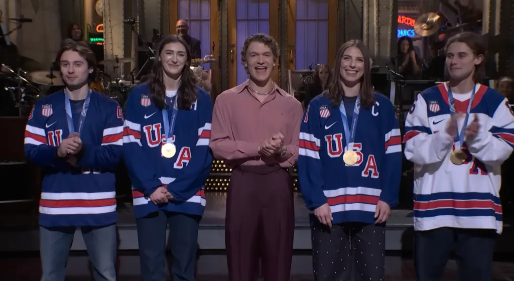 Connor Storrie with US hockey stars Quinn Hughes, Jack Hughes, Hilary Knight, and Megan Keller.