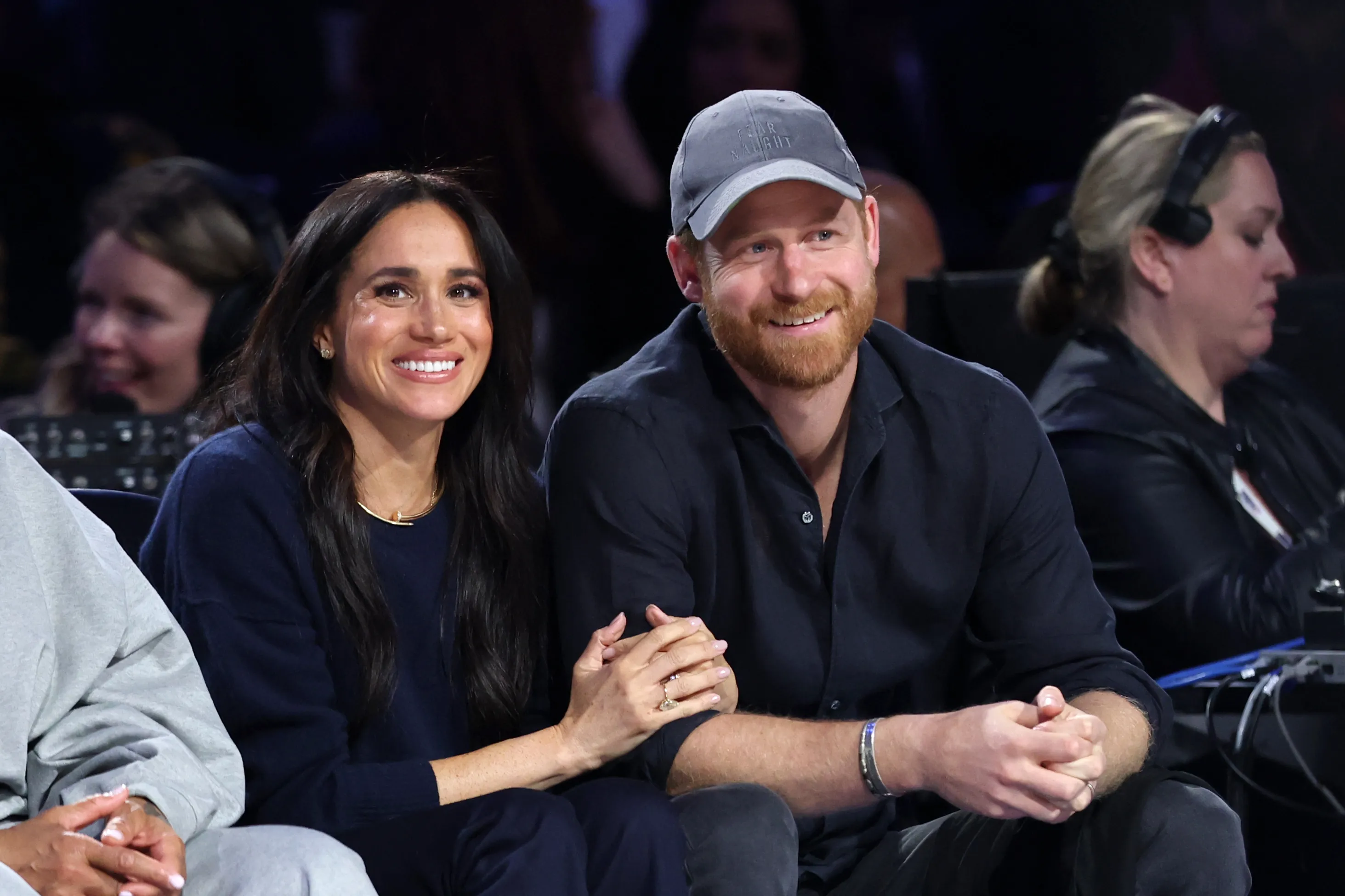 Meghan, Duchess of Sussex and Prince Harry, Duke of Sussex smiling while attending the 75th NBA All-Star Game.