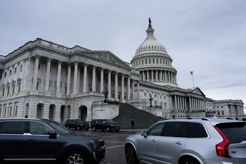 Vehicles line up outside the US Capitol Building.