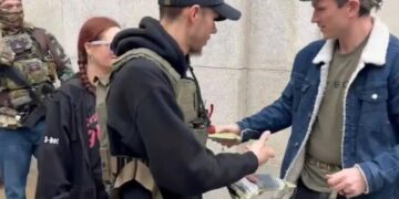 Gun activists hand out AR-15 magazines at Capitol to defy upcoming ban