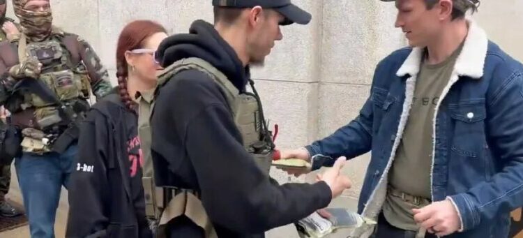 Gun activists hand out AR-15 magazines at Capitol to defy upcoming ban