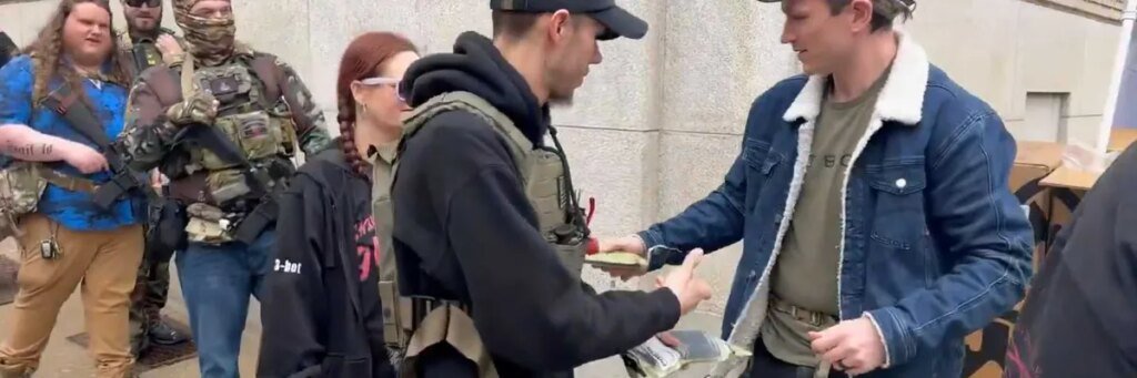 Gun activists hand out AR-15 magazines at Capitol to defy upcoming ban