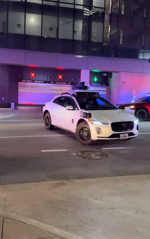 A self-driving Waymo car blocking emergency vehicles during a shooting.