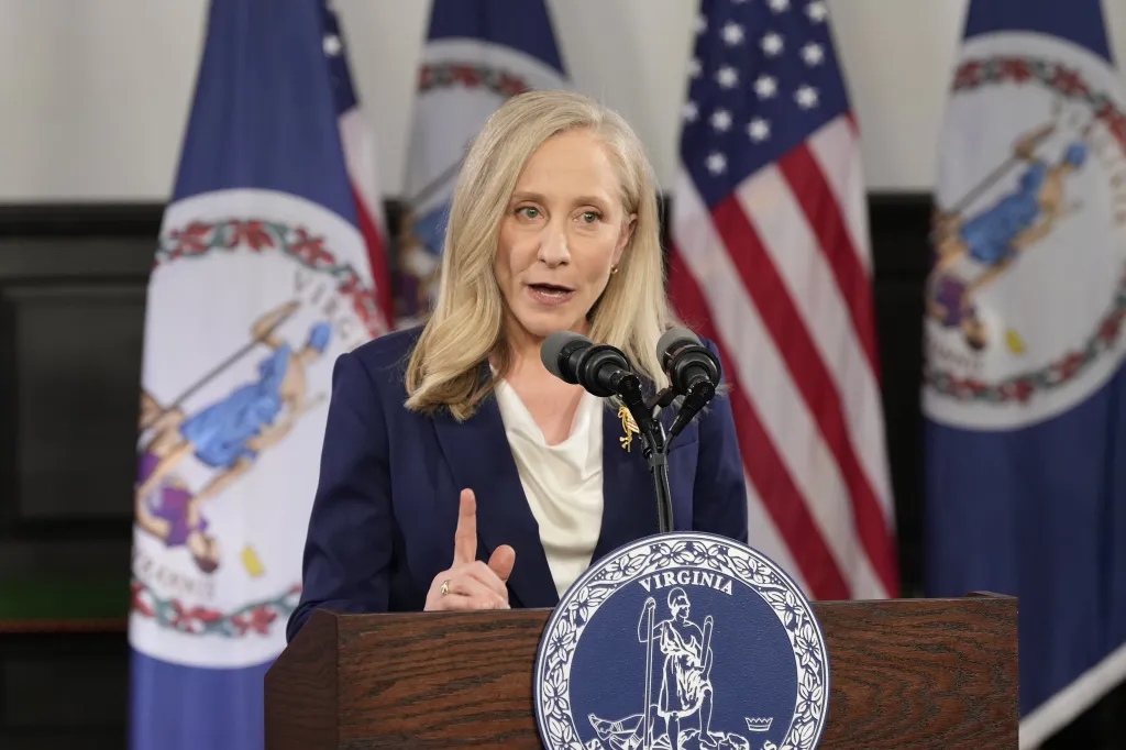 Virginia Gov. Abigail Spanberger speaking at a podium with the Virginia state seal and flags, delivering the Democratic response to the State of the Union address.