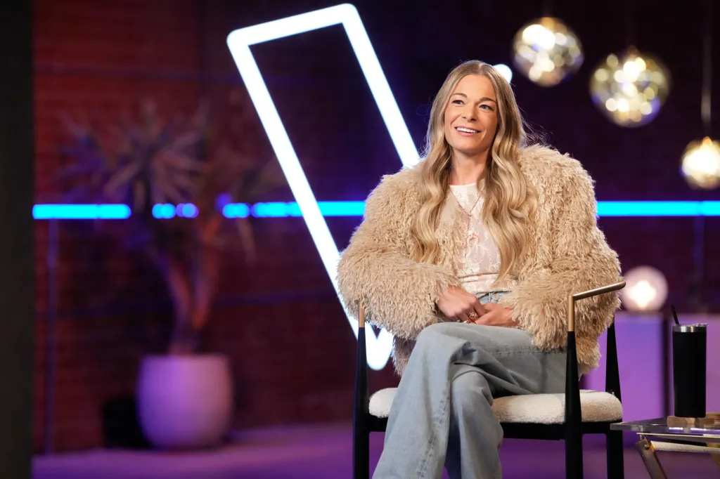LeAnn Rimes smiling in a beige fuzzy coat on