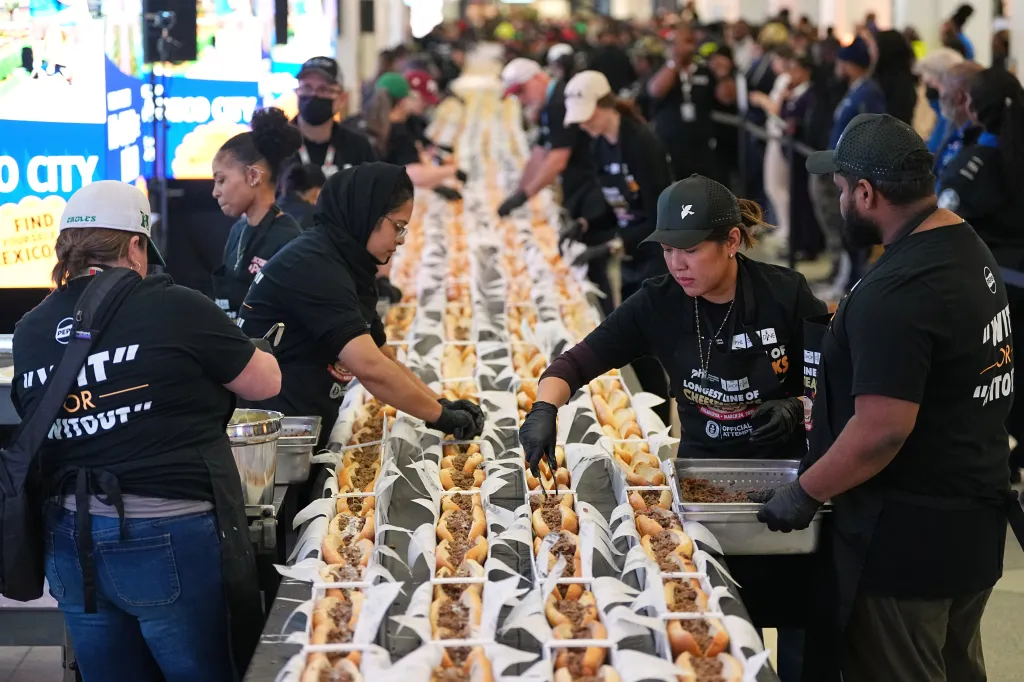 Volunteers assemble cheesesteaks at Philadelphia International Airport.