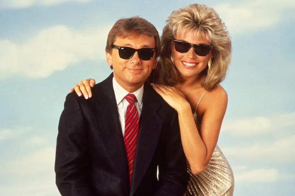 Pat Sajak and Vanna White wearing sunglasses.