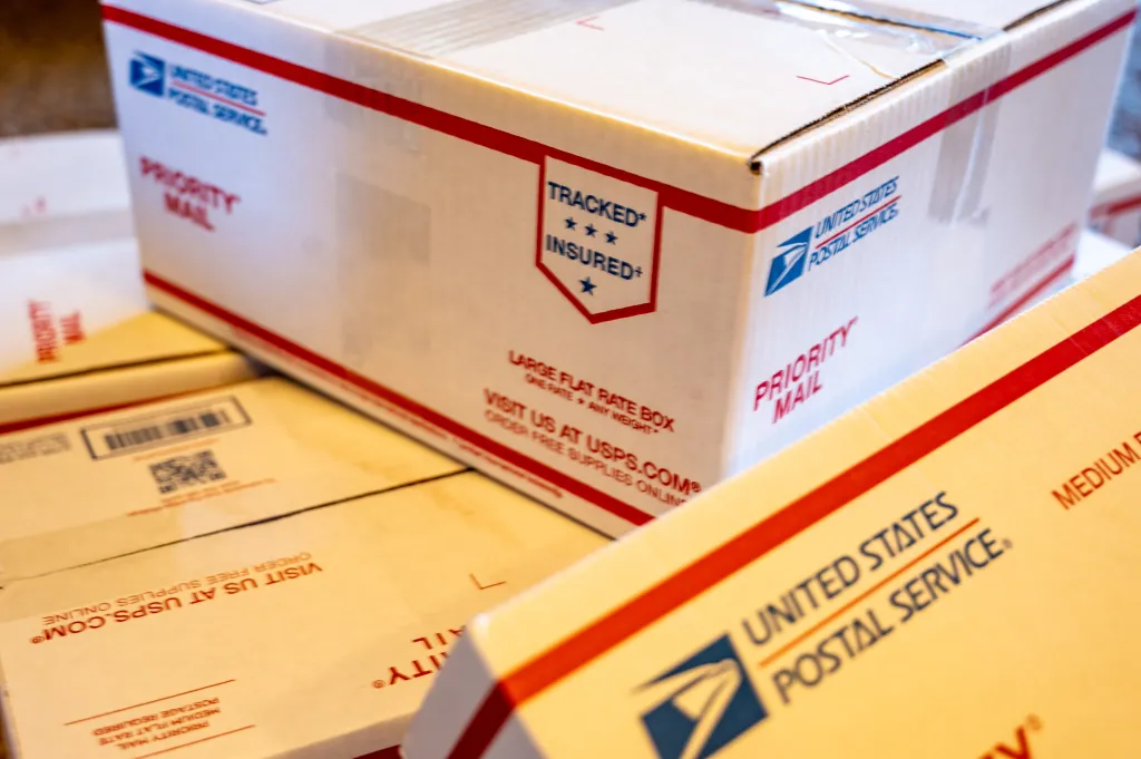 USPS packages marked for delivery in Tiffin, Iowa in December 2020.