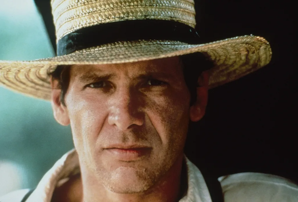 Harrison Ford wearing a straw hat, from the film *Witness*.