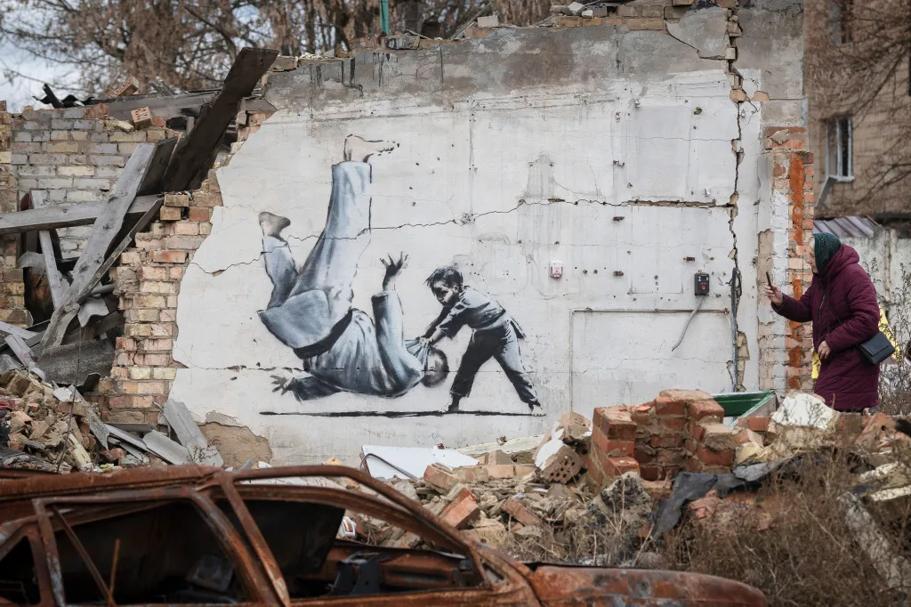 An alleged artwork of Banksy's is displayed on a building destroyed by fighting in Ukraine on Nov. 13, 2022.