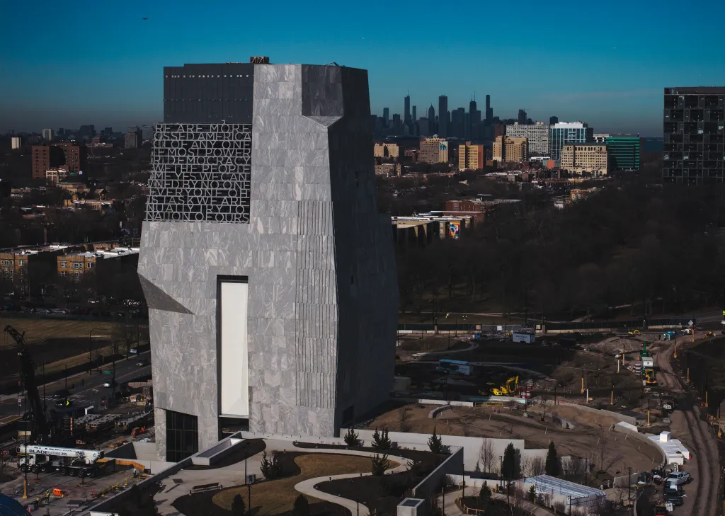Obama Presidential Center under construction, with the Chicago skyline in the background.