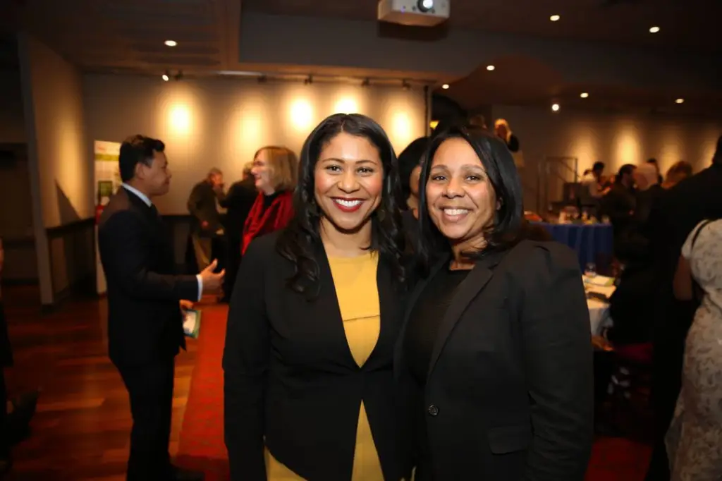 Former San Francisco Mayor London Breed and Sheryl Davis smile together.