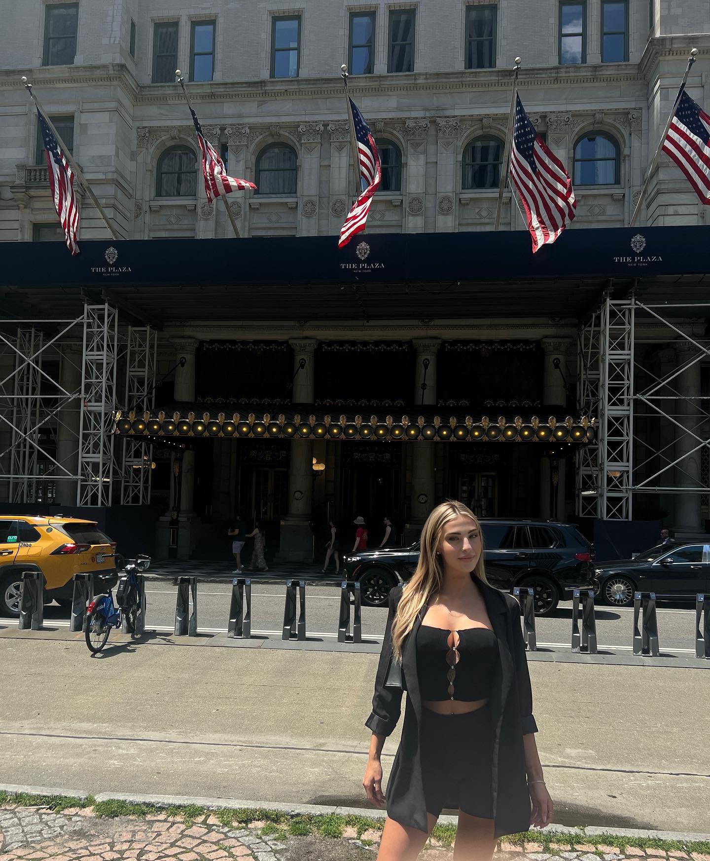 Sarah Tena posing in front of The Plaza Hotel in New York City.