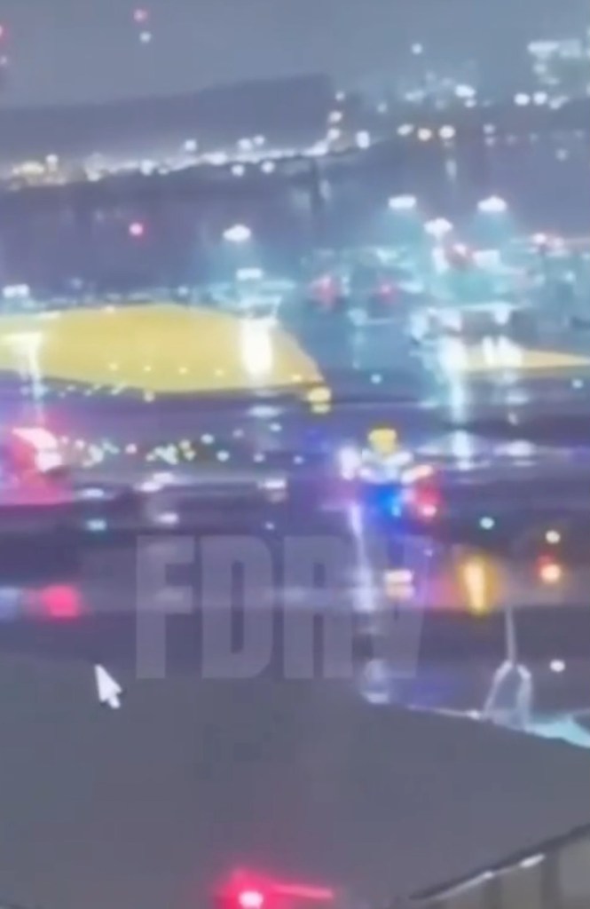 Air Canada Express jet colliding with a fire truck on a runway at LaGuardia Airport.