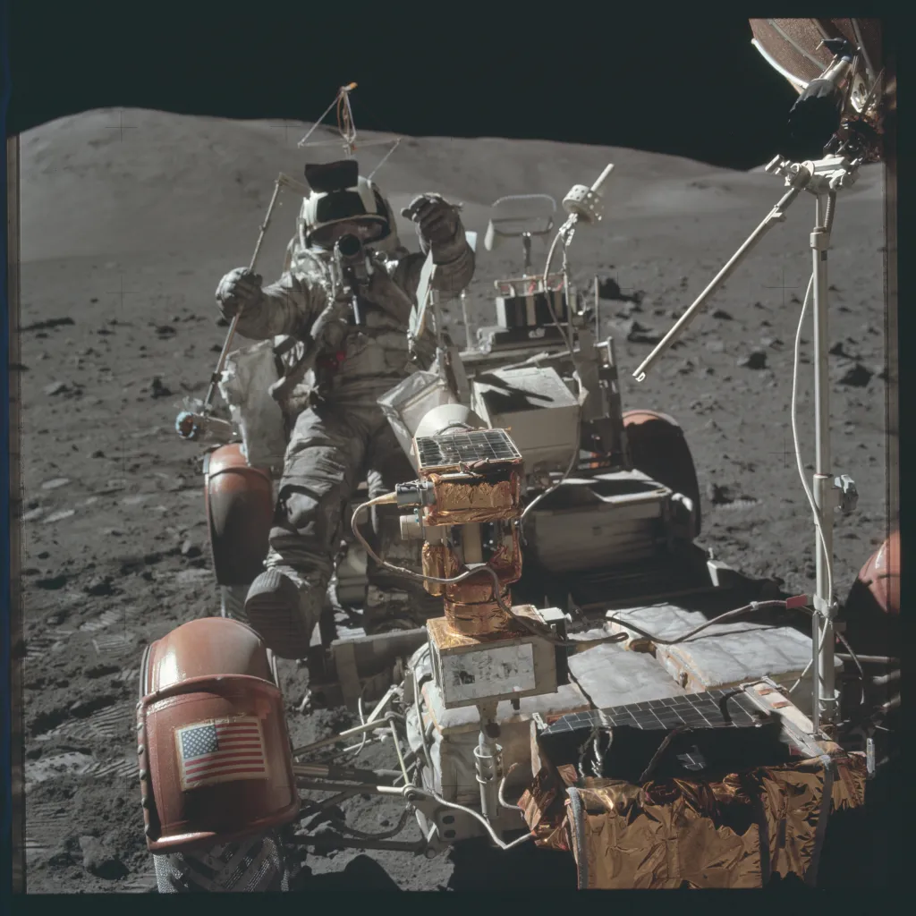 Astronaut Harrison H. Schmitt seated in the Lunar Roving Vehicle on the moon.