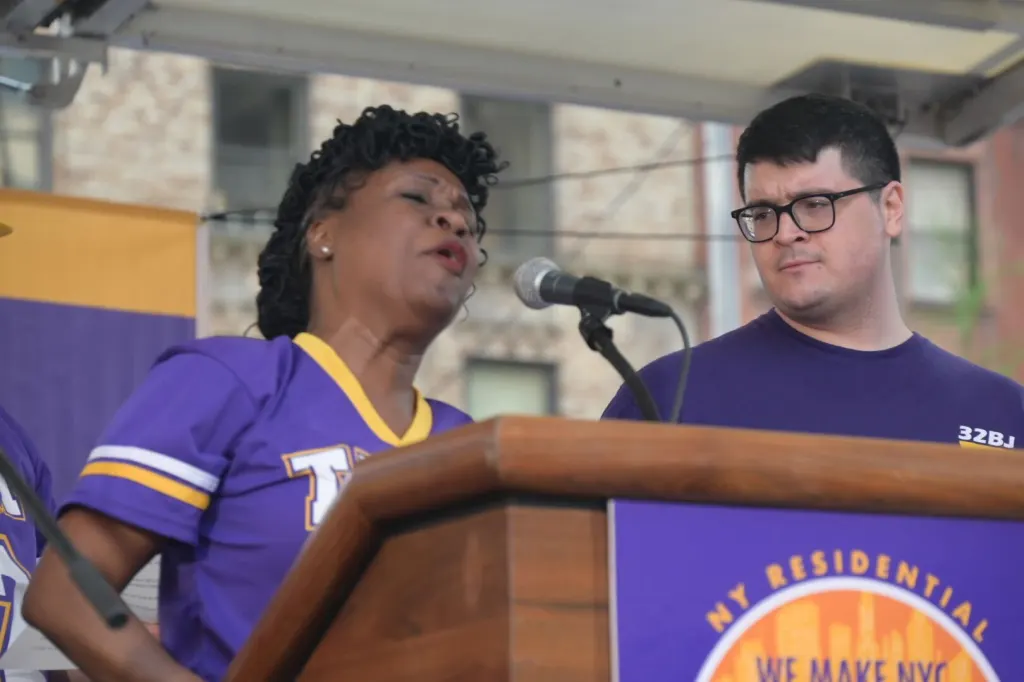 Charles Vega (on the right) joining the doormen protest against the increase of health care fees.