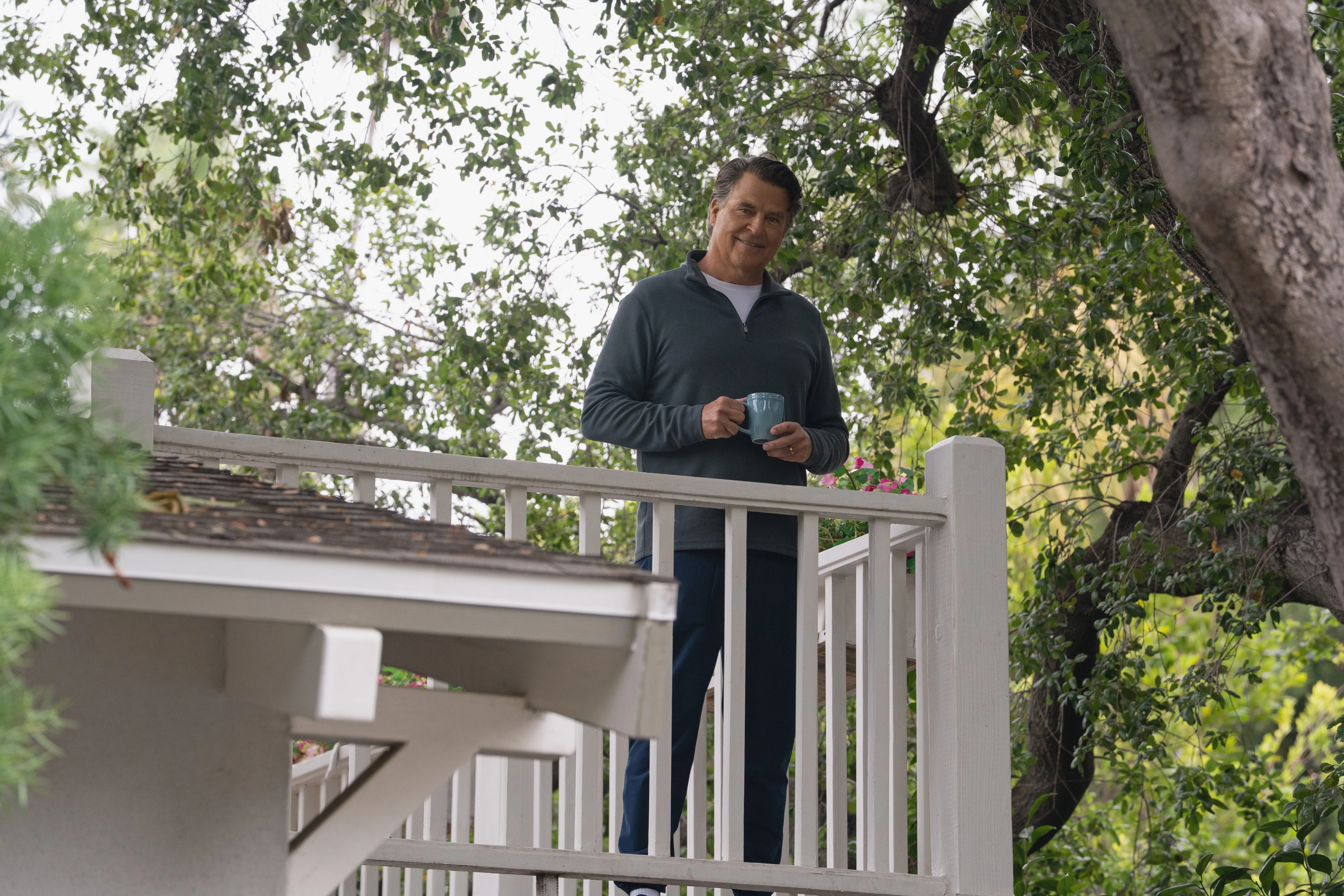 Ted McGinley holding a coffee cup
