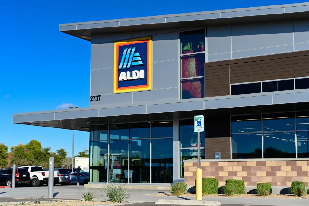 Exterior of an Aldi grocery store with branded signage and glass storefront.