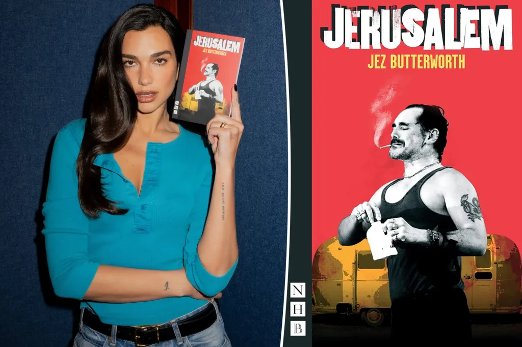 Dua Lipa holds a book titled 