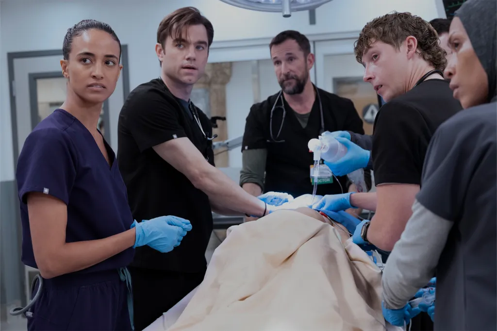 Doctors and nurses working on a patient in an operating room.