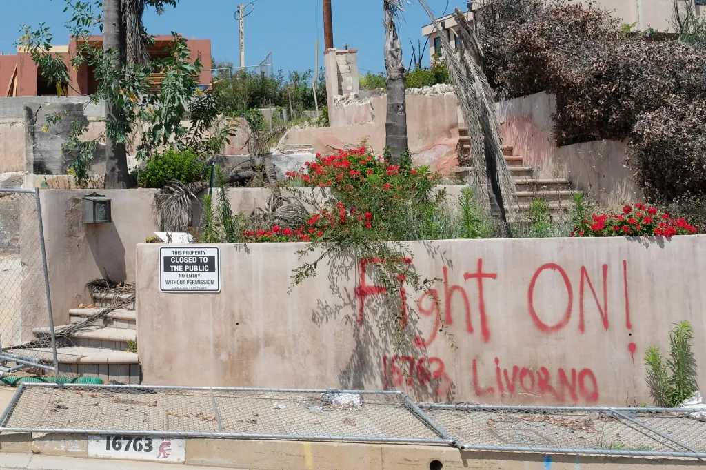 A property that appears to be under construction with a sign that reads