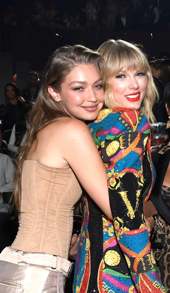 Gigi Hadid and Taylor Swift embrace at an event.