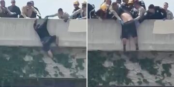 Heart-stopping moment rescuers swoop in on man trying to jump from LA overpass