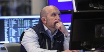 Stocks retreat from record highs as Tesla weighs on Wall Street and oil jumps on Iran uncertainty