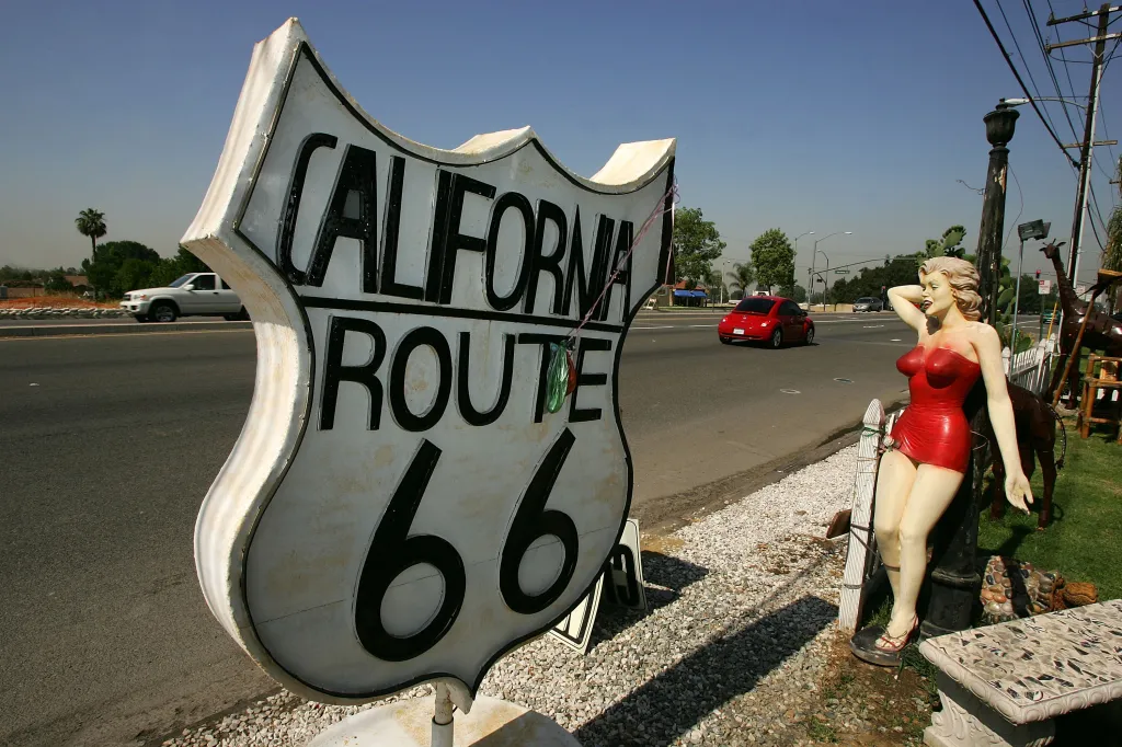 A Marilyn Monroe statue beside a Route 66 sign in California.