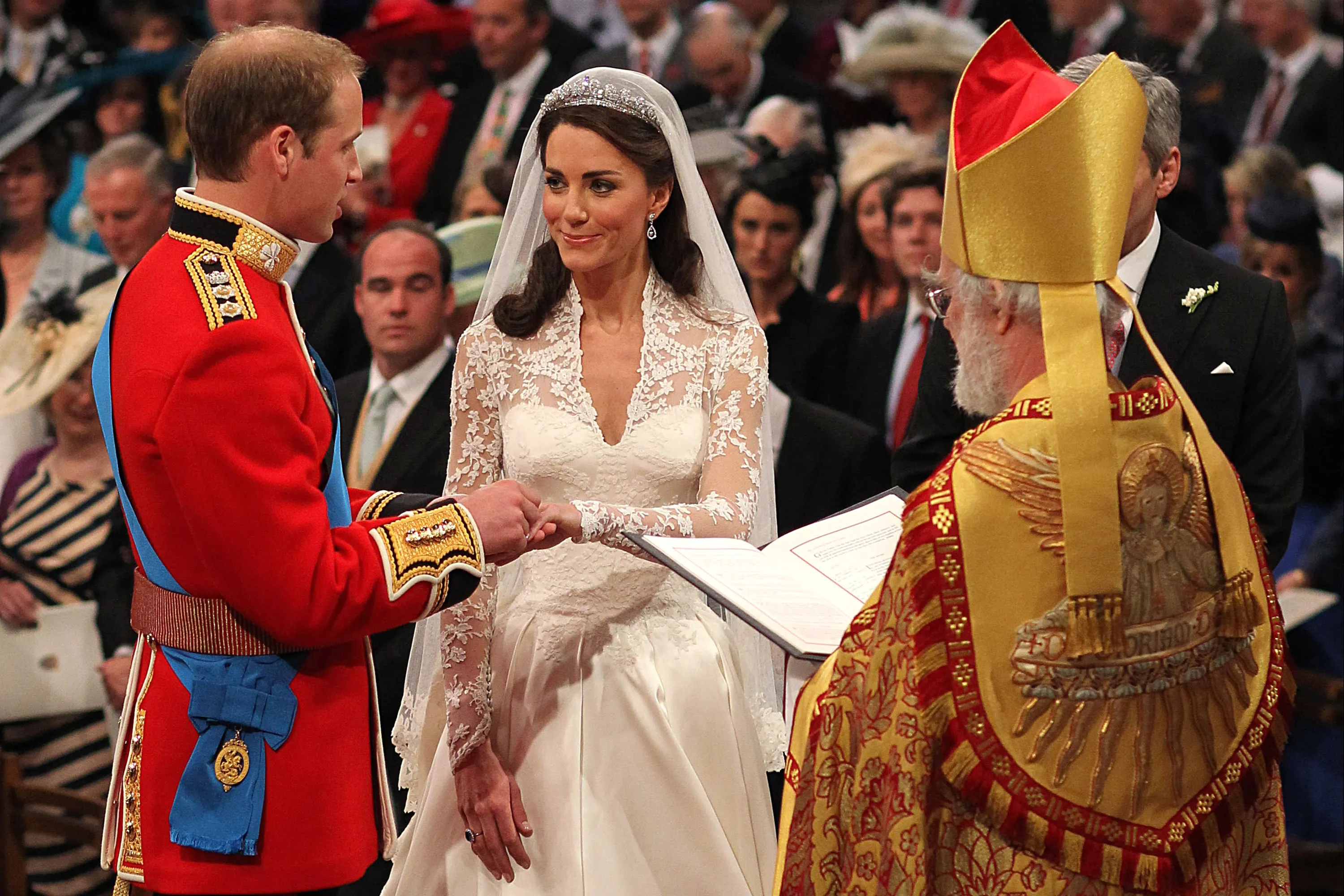 Prince William places a ring on Catherine Middleton's finger during their wedding ceremony at Westminster Abbey.