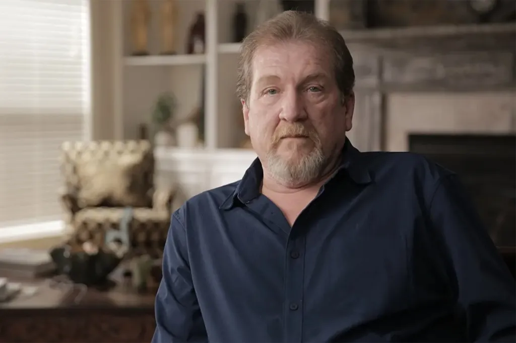 A man with a goatee and mustache looking at the camera.
