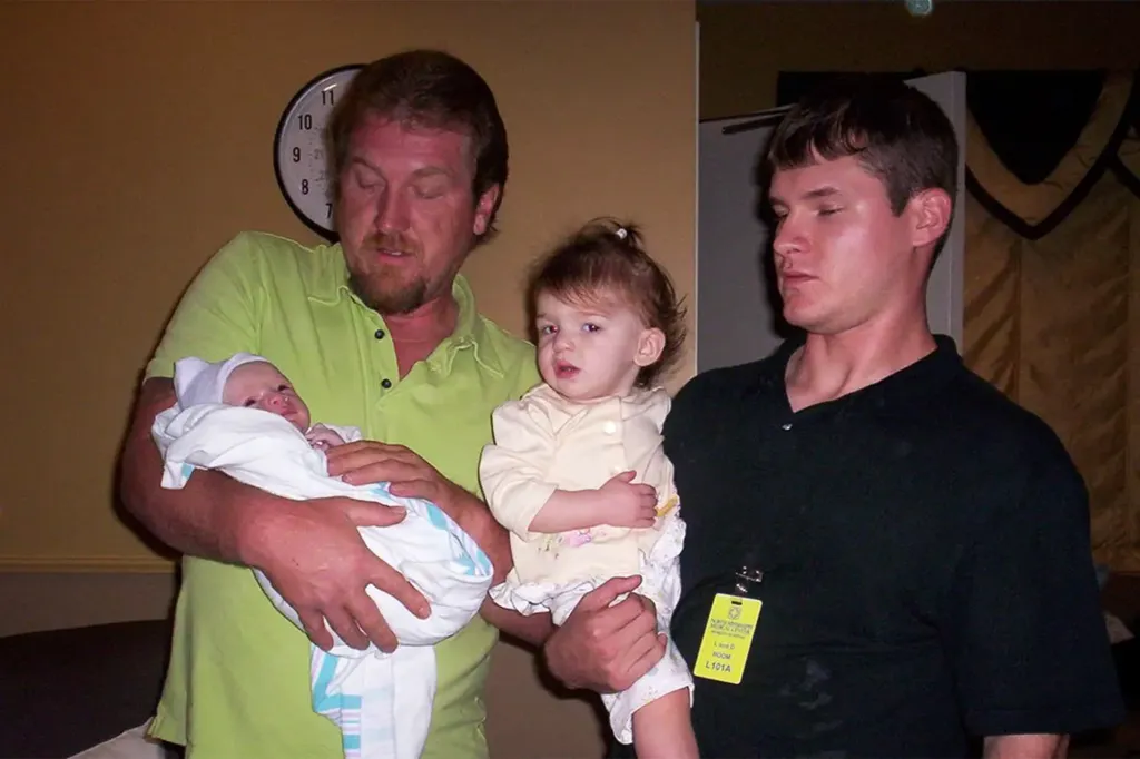 Timothy Ray Jones Jr. with his father and his children in an undated photo.
