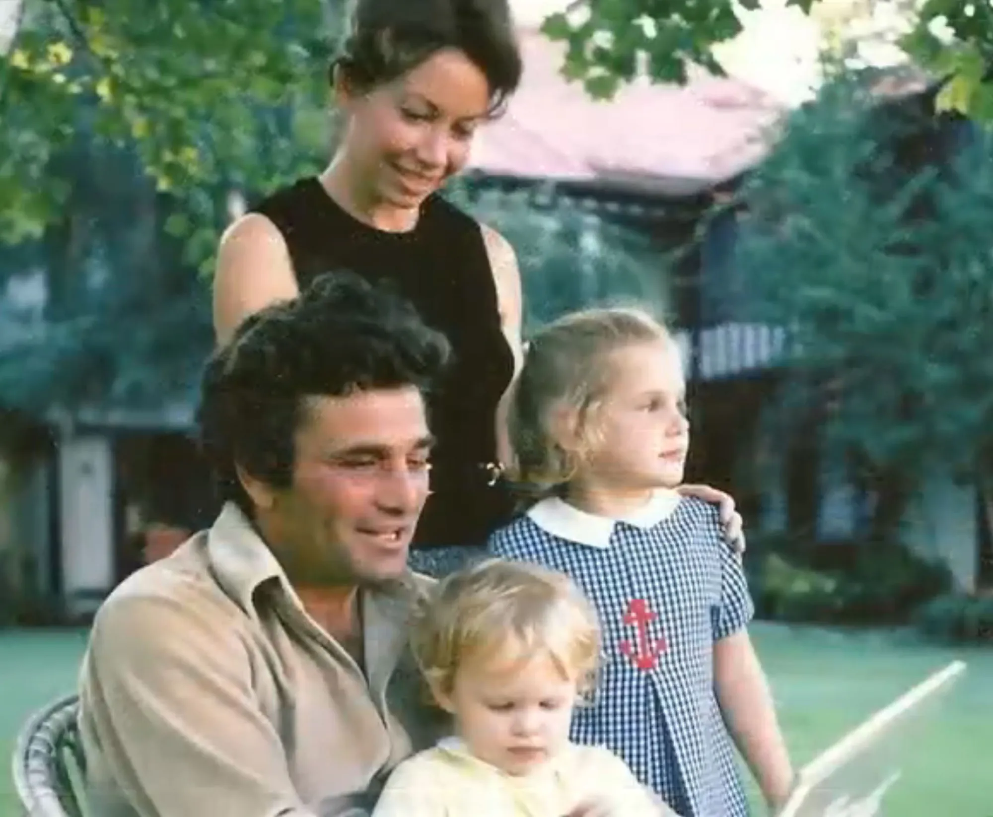 Alyce, Peter, Catherine, and Jacqueline Falk posing for a family photo.