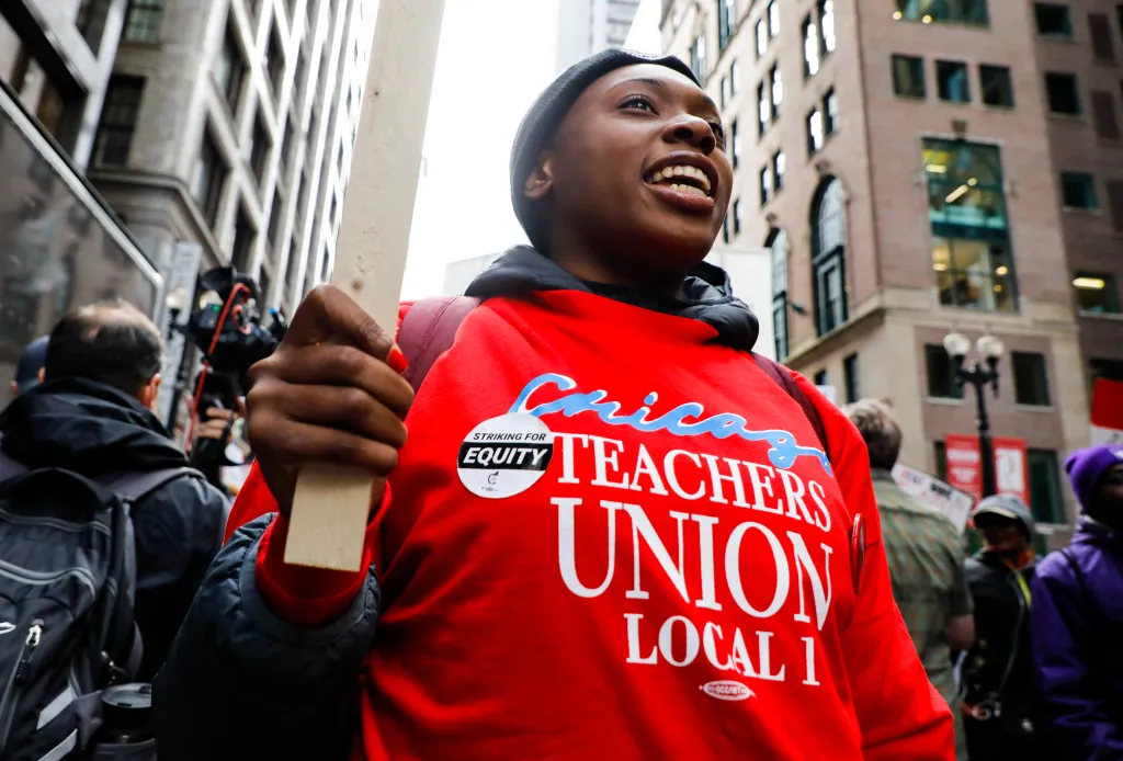 A teacher takes part in the Chicago Teachers' Union strike rally in downtown Chicago, the United States, on Oct. 17, 2019.