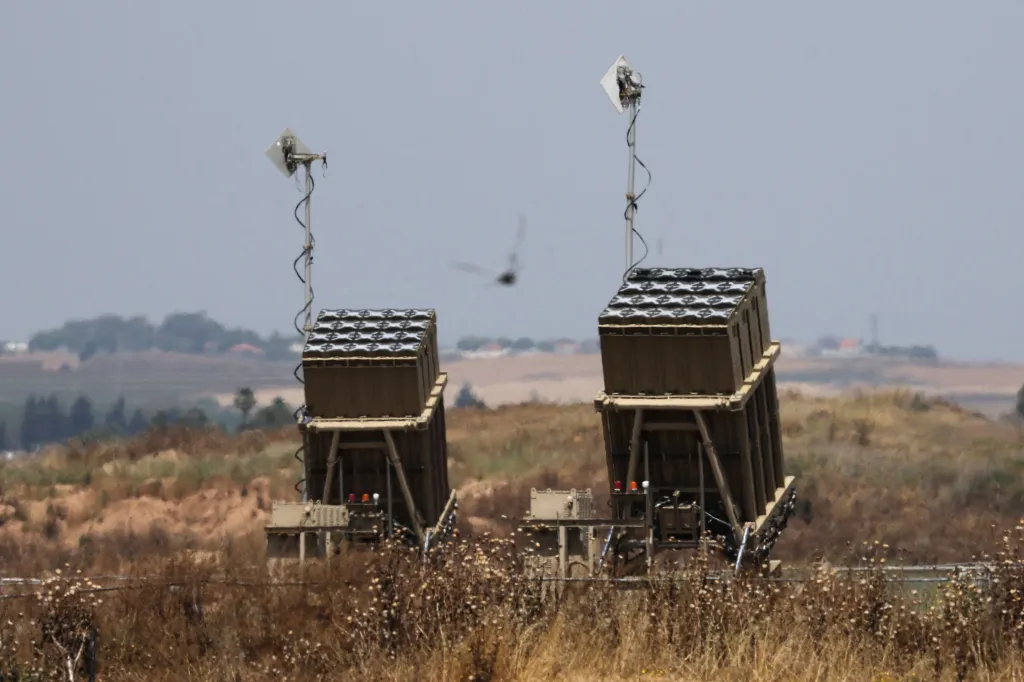 Two batteries of Israel's Iron Dome air defense system in a field.