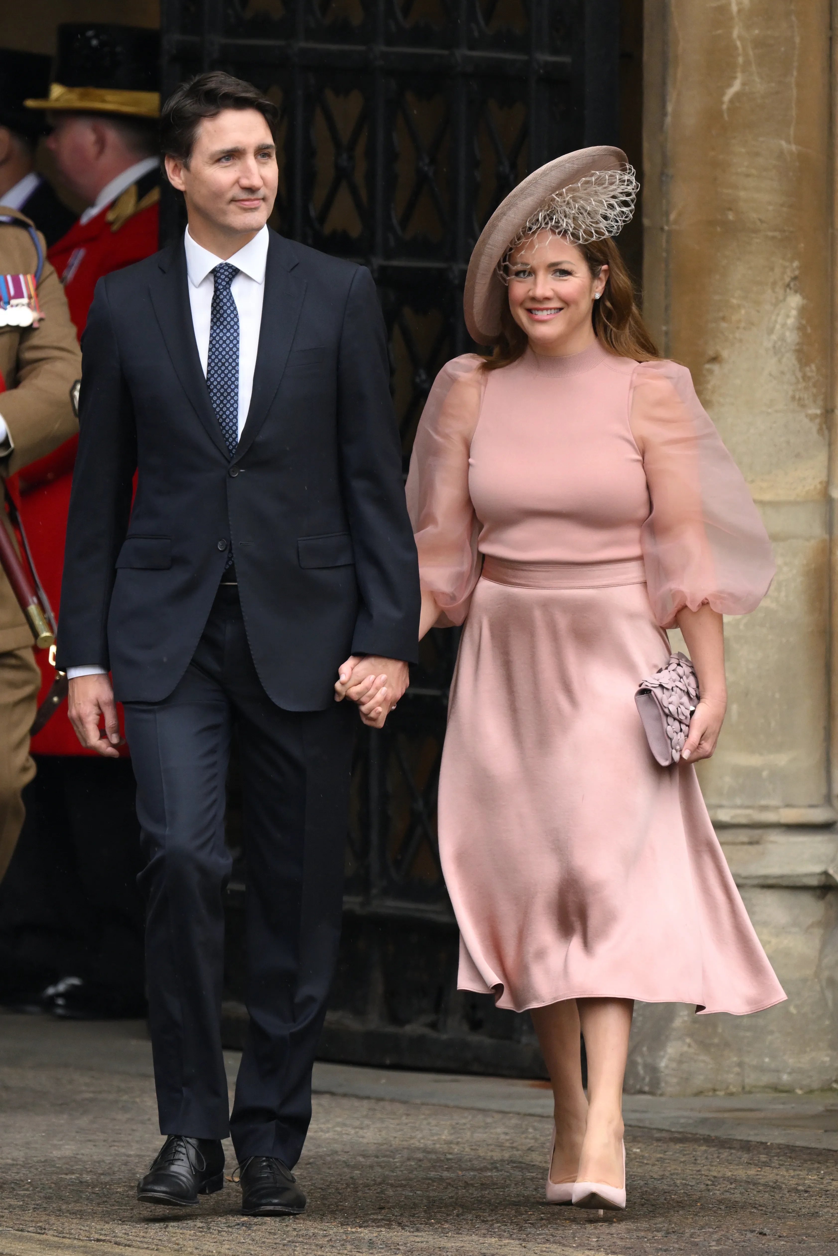 Justin Trudeau and Sophie Grégoire Trudeau hold hands as they arrive at Westminster Abbey.