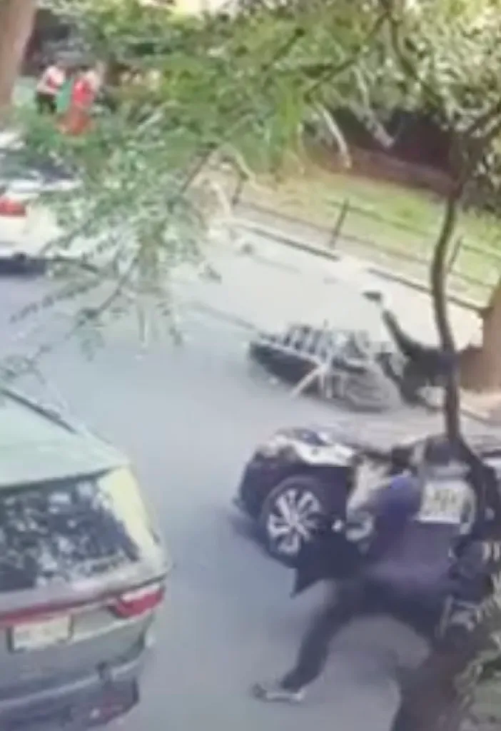 Surveillance video still shows an NYPD sergeant striking a suspect with a cooler during a drug bust.