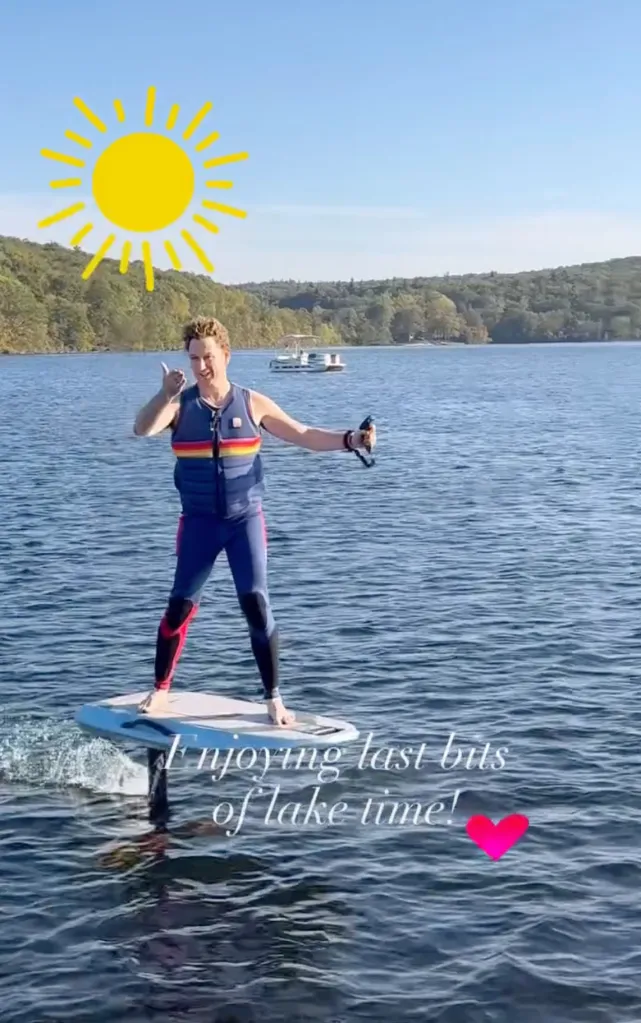 Stefan Pildes on an eFoil surfboard, giving a thumbs up.