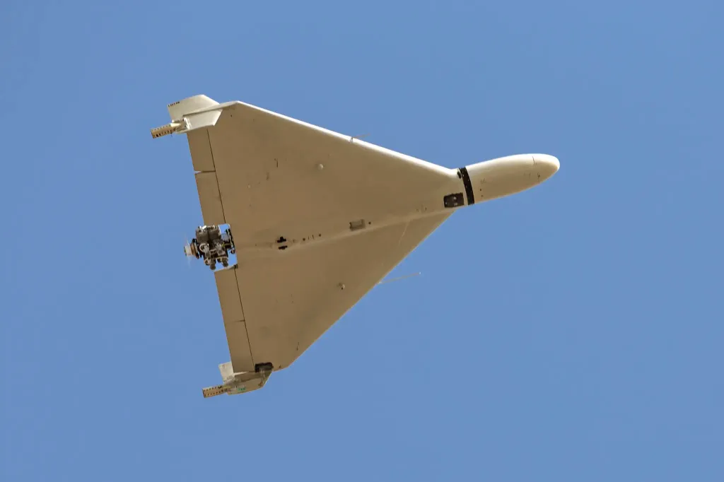 Iranian-made Shahed-136 'Kamikaze' drone flying over a blue sky.
