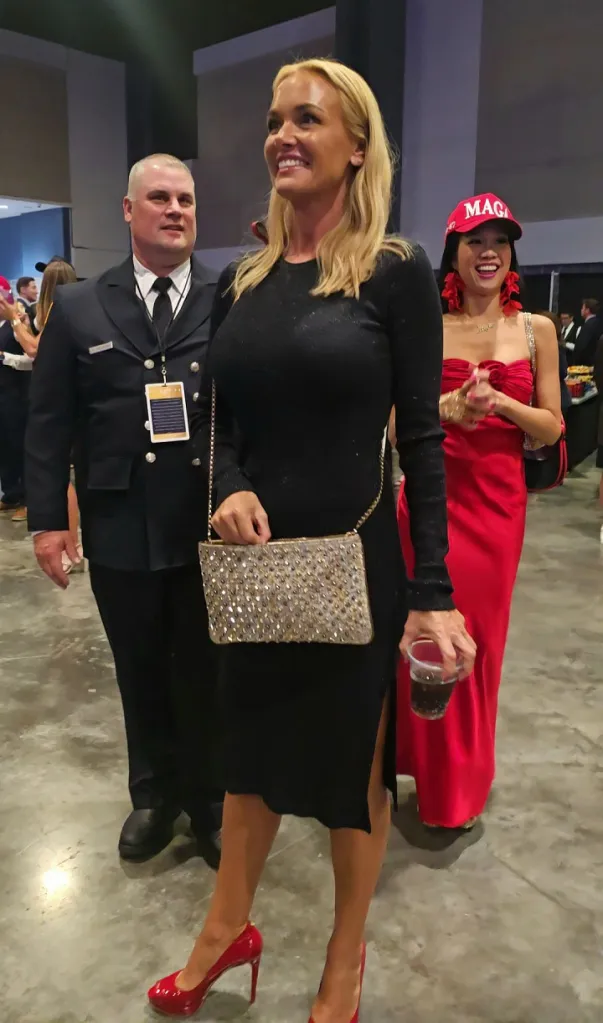 Vanessa Trump laughing with firefighter Charles Kazlauskas.
